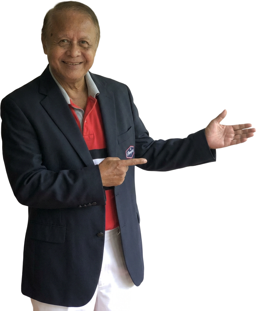 Ted, Amanda's father, gesturing toward the meaning of Merdeka